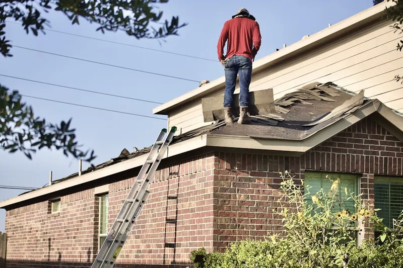 Professional roofer working on a residential roof in Original Buckhorn Estate